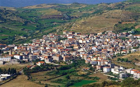 an aerial view of a village in the mountains