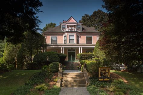 Welcome to The Lion and the Rose Bed and Breakfast, a romantic pink-lady inn with lush grounds ...