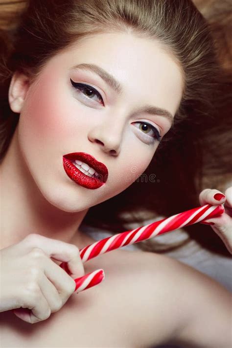 Girl with Candy. Red Lipstick on the Lips. Stock Photo - Image of pose, manicure: 66418630