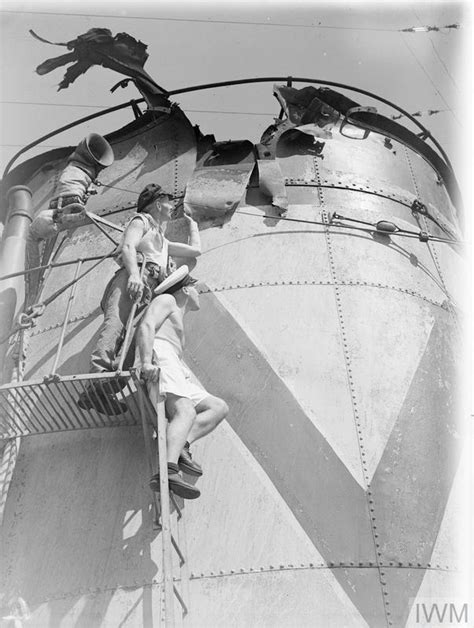 The crew of HMS Saumarez inspecting the damage suffered during Battle of the Malacca Strait. May ...