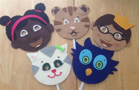 Daniel Tiger character masks. Just felt, poster board, and white glue. The handles are p ...