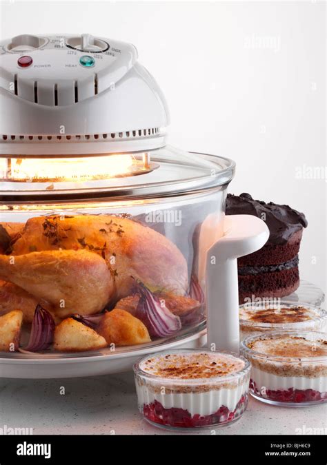 Halogen oven with chicken cooking Stock Photo - Alamy