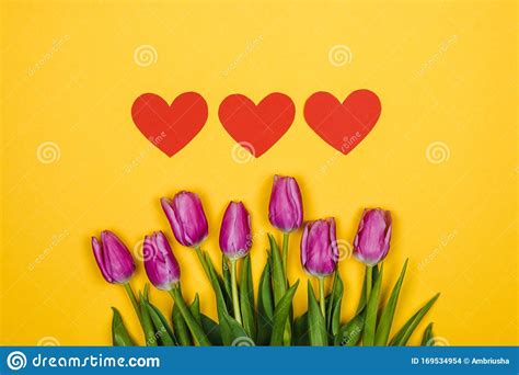 Pink, Purple Tulips and Three Red Hearts on Yellow Background Stock ...