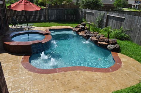 This small pool and spa in Katy Tx (Houston, TX) features stamped overlay concrete deck in an ...