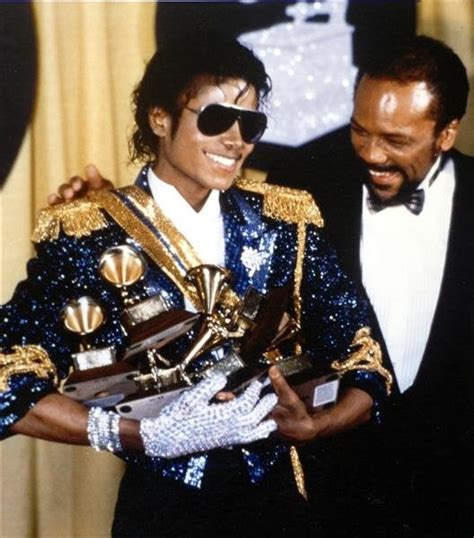 Michael Jackson holding 8 grammys won in one night (current Grammy record) : pics