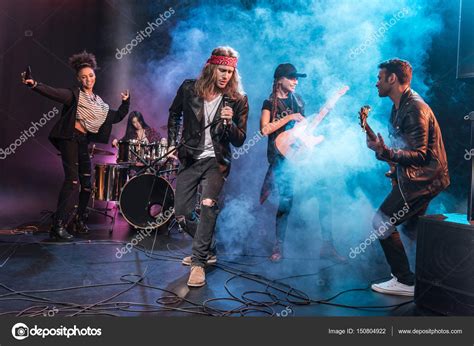 Rock band on stage — Stock Photo © TarasMalyarevich #150804922