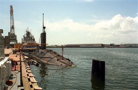 A port quarter view of the British nuclear-powered attack submarine HMS VALIANT (SSN-102) tied ...