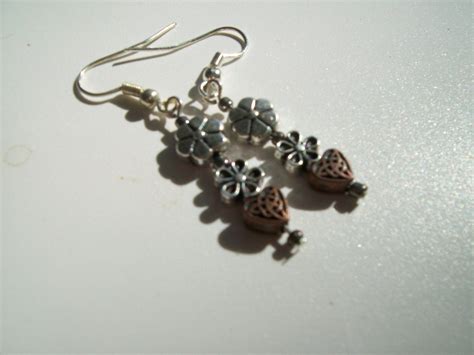 Southwestern style copper and silver earrings, hearts and flowers, mixed metal