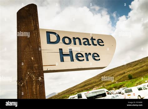 Donate here sign hi-res stock photography and images - Alamy