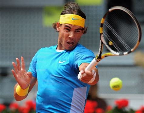 Rafael Nadal hits a top spin forehand in Madrid 2010.JPG