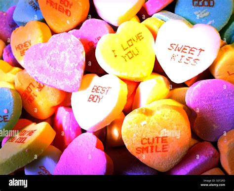 Valentine's Day candy conversation hearts in vibrant colors Stock Photo - Alamy