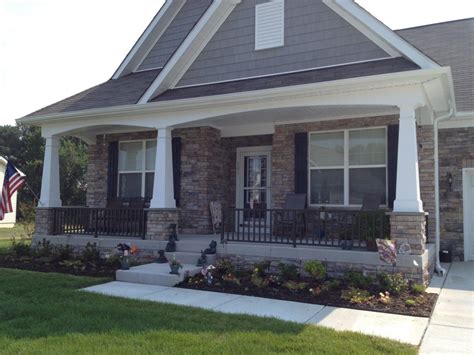 Porch With White Columns With Black Railing — Randolph Indoor and Outdoor Design