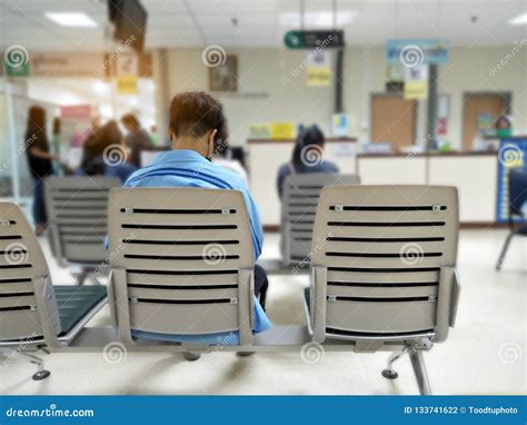 Young Man and Many People Waiting Medical and Health Services To the ...