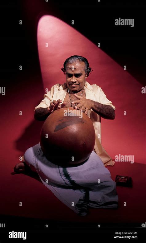 Indian Musician Playing Percussion Musical Instrument Ghatam In Concert ...