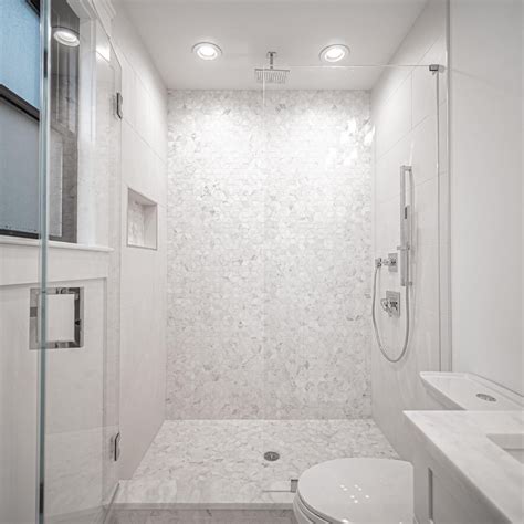 Bright white marble bathroom is elegant and timeless. But it is also modern with this cool ...