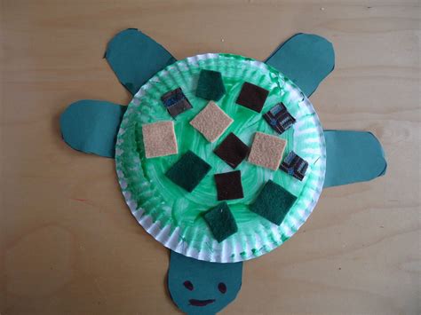 Under the sea turtle art: The children cut out green paper to make legs and a head for their ...