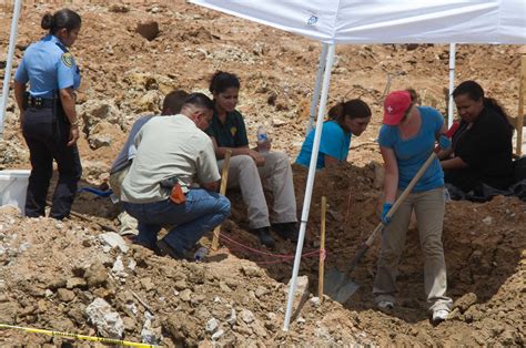 At construction site, forensic team searches for human remains