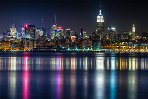 Midtown Manhattan From Jersey City At Night Photograph by Val Black Russian Tourchin