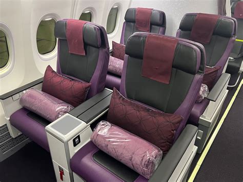 Review: Qatar Airways Boeing 737 MAX First Class (AUH-DOH) - One Mile ...