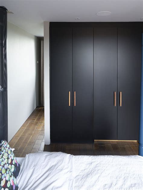 Black Matt Lacquer Wardrobes with bespoke oak handles | Bedroom closet ...