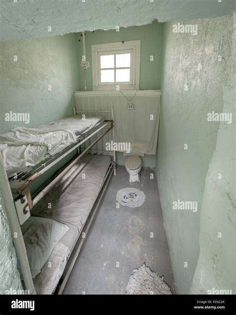 Old prison cell with bunk beds Stock Photo - Alamy