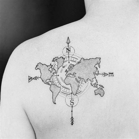 a man's back with a world map tattoo on his left shoulder and an arrow in the middle