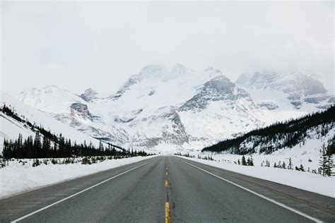 Road leading into the mountains 1237756 Stock Photo at Vecteezy