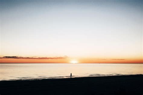 Premium Photo | Silhouette of person on beach