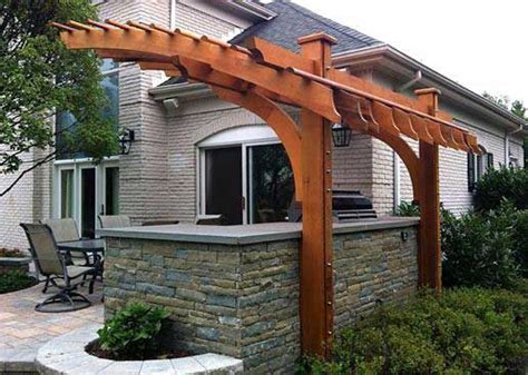 The cantilevered pergola, while maintaining an open feeling, provides a sense of intimacy and ...