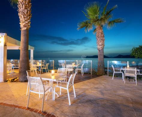 Beautiful Cafe on Sea Coast at Night in Summer. Chairs and Tables Stock Image - Image of night ...