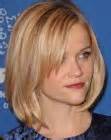 Brunette Reese Witherspoon with layered and rolled hair