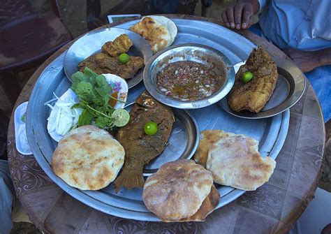 Traditional Breakfast With Fishes, Foul, And Bread,dongola, Sudan ...