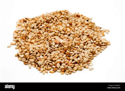 Sesame seeds on a white background Stock Photo - Alamy