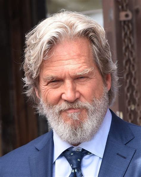 Jeff Bridges wearing a blue suit with a light blue shirt and tie with his grey hair worn… | Best ...