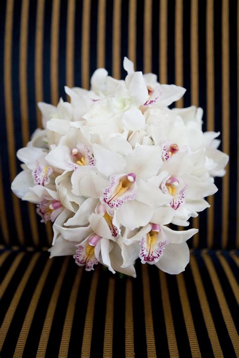 white orchid bridal bouquet with touches of pink