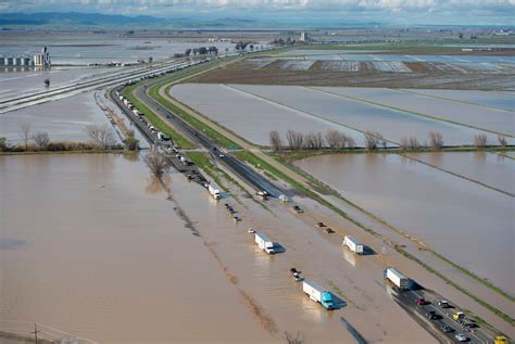 Photos: California storms cause flooding, downed trees and sinkholes