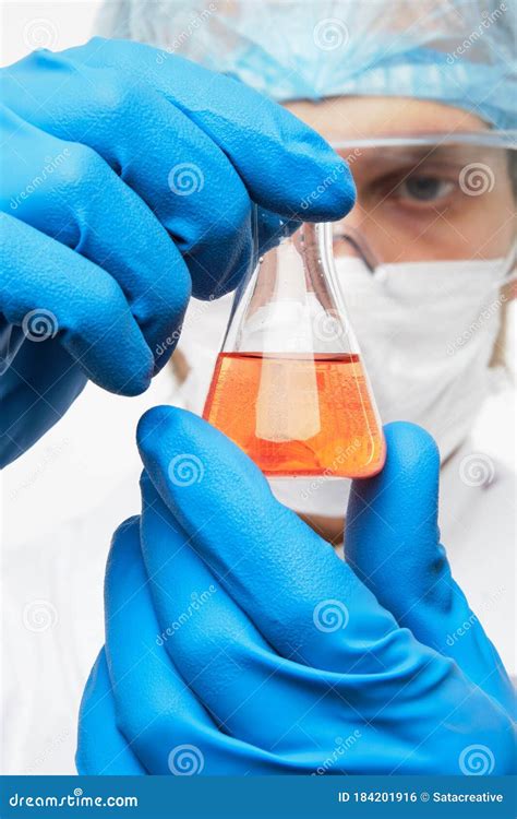 Laboratorian Eximining Test Tube with Orange Liquid Stock Photo - Image of science, equipment ...