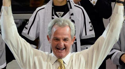 Darryl Sutter and Darryl Sutter's face hoist the Stanley Cup - SBNation.com