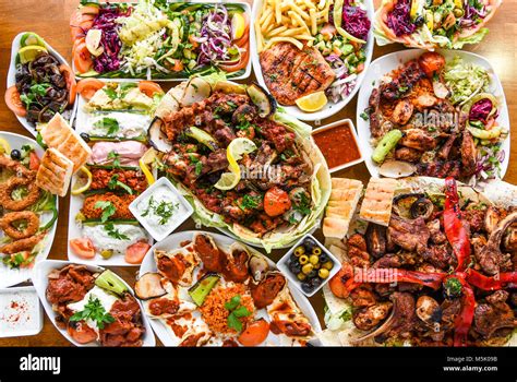 Variety of lebanese food on a table Stock Photo - Alamy