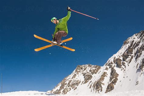 "Man Performing Skiing Helicopter Trick Against The Blue Sky" by Stocksy Contributor "Ibex.media ...