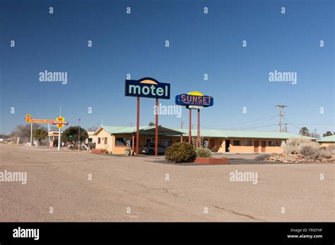 Moriarty, New Mexico - February 2, 2019: Colorful sign of the sunset motel on historic route 66 ...