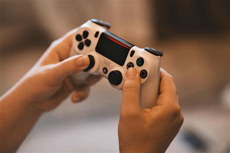 Person Holding Sony Ps4 Controller · Free Stock Photo