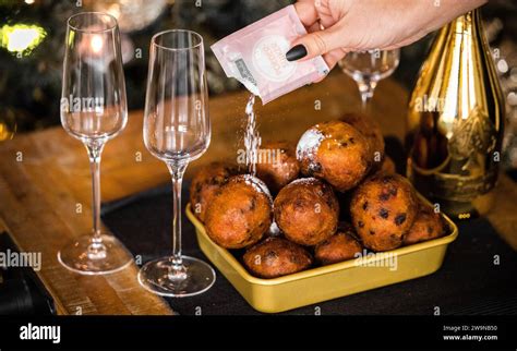 ILLUSTRATIVE - Oliebollen with powdered sugar during the celebration of ...