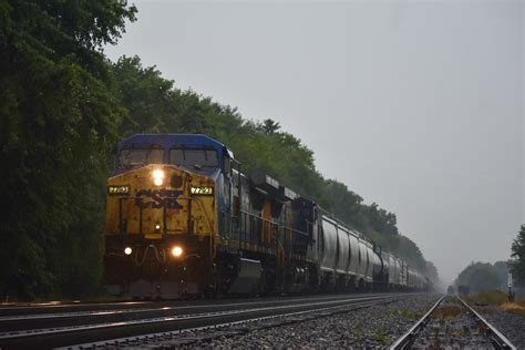 A CSX C40-8W in the YN2 paint scheme leads a YN3 C44-9W on an eastbound manifest during a ...