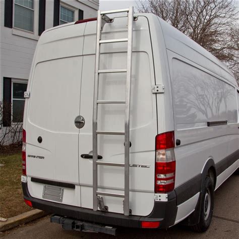 a white van parked in front of a house with a ladder attached to the back