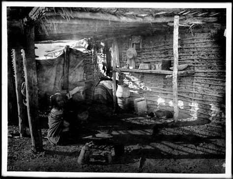 Yuma Indian woman sitting in shadow by her cooking fire in… | Flickr