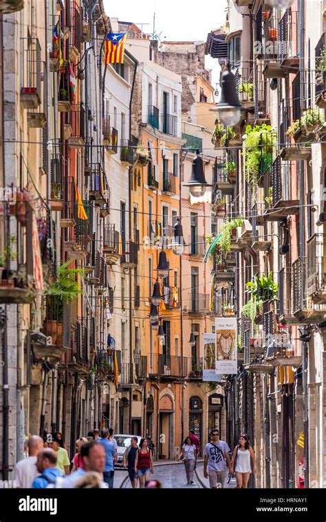 Narrow balcony filled street, Barri Vell Old Quarter, Girona, Spain Stock Photo - Alamy