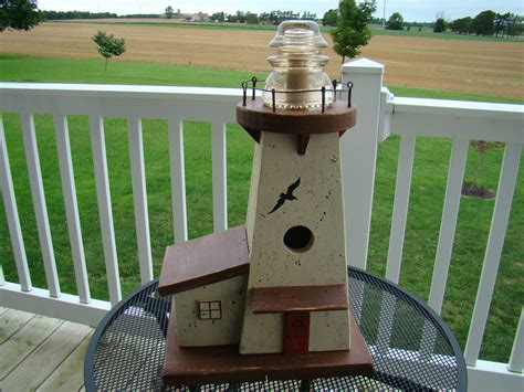 we built this birdhouse in the form of a lighthouse and topped it off ...