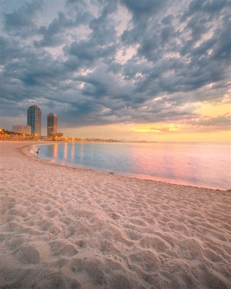 Barceloneta Beach in Barcelona at sunrise | Barceloneta beach, Barcelona travel, Barcelona beach