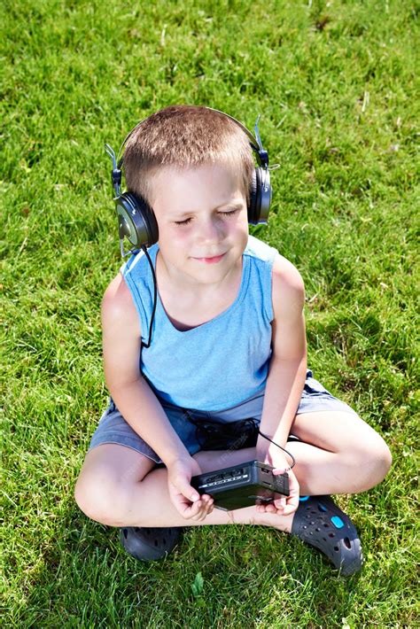 Premium Photo | Little boy with audio cassette player and headphones